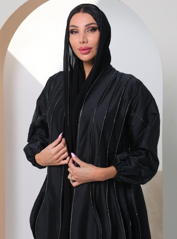 Burgeoning Beauty: Revel in the Exquisite Craftsmanship of Black Taffeta Abayas with Bulge Designs and Silver Streaks.
