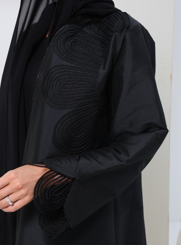 Corded Fantasy: Unveiling Intricacy in Black Back Cut Abayas with Exquisite patterns and designs.