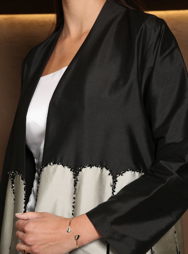 Effortless Glamour in Black Scallop Abayas Enhanced with Stunning Beadwork.