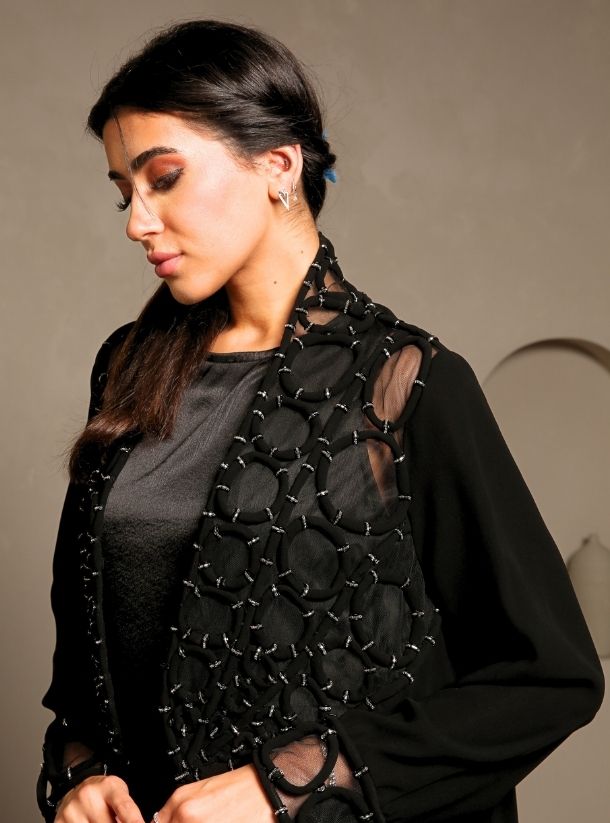 Exquisite Elegance, Unveiling the Corded Obsidian Masterpiece, Adorned with Handcrafted Bosom Sleeves.