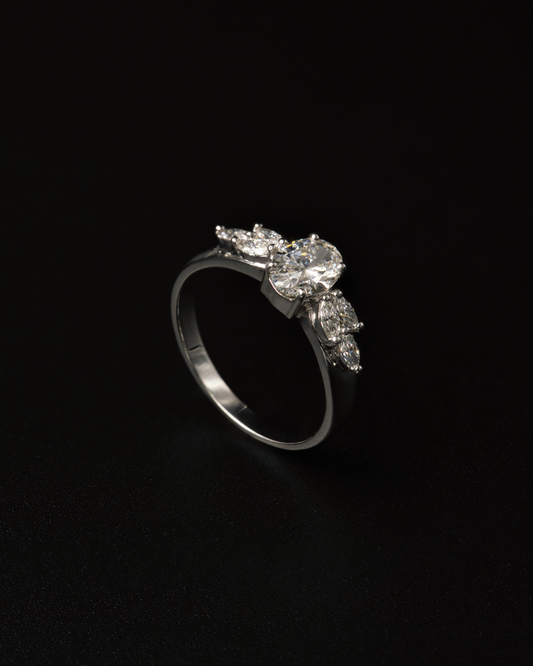 NATURAL DIAMOND OVAL SOLITAIRE AND MARQUISE PETAL RING