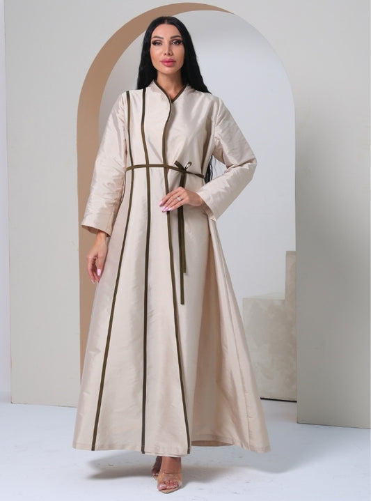 Golden Whisper: A Luxurious Beige Abaya Featuring Elegant Knot-style Accents and Delicate Wavy Corded Patterns Adorning the Front.