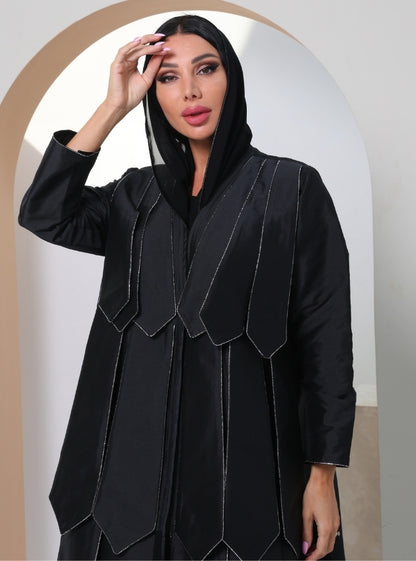 Timeless Canvas: Onyx Abaya adorned with glistening crystals, pleated with contemporary allure.