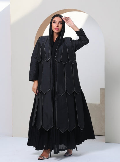 Timeless Canvas: Onyx Abaya adorned with glistening crystals, pleated with contemporary allure.