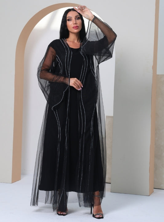 Stardust Elegance: A Luxurious Black Tulle Abaya Adorned with Exquisite Crystalline Wave Patterns.