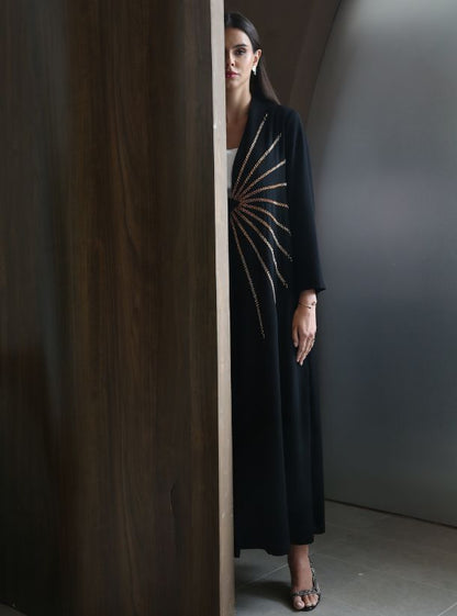 Gilded Dawn, Mesmerizing Black Abaya featuring a One-Sided Rose Gold Sun Rising Pattern.