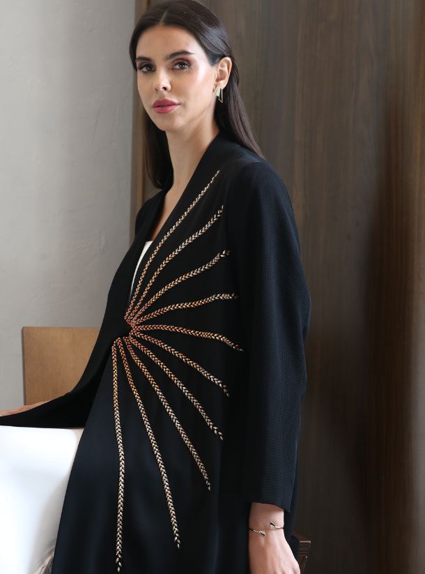 Gilded Dawn, Mesmerizing Black Abaya featuring a One-Sided Rose Gold Sun Rising Pattern.